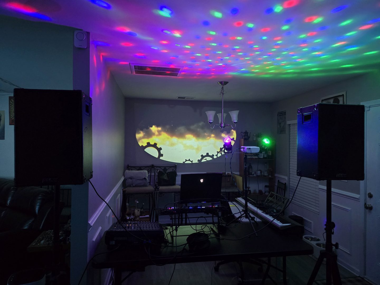 Sound, projection and colorful ceiling lighting in a compact party setup